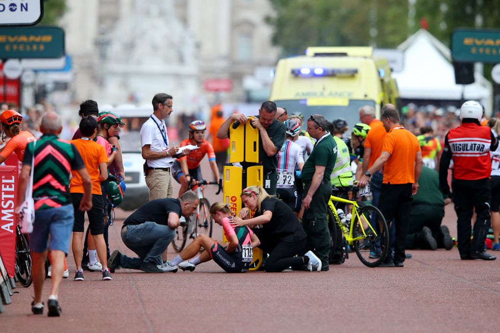 Medical personnel and team staff tend to riders at RideLondon Classique