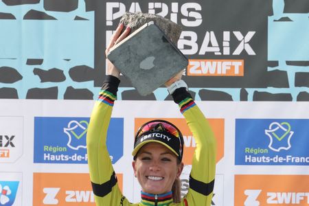 First placed Team Visma-Lease a Bike's French rider Pauline Ferrand Prevot celebrates with her award on the podium of the fifth edition of the Paris-Roubaix women's race, 148,5 km between Denain and Roubaix, northern France on April 12, 2025. (Photo by Francois LO PRESTI / AFP)