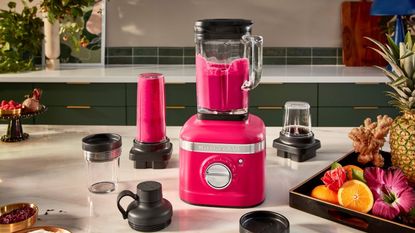One of the best blenders, the KitchenAid K400 blender in hibiscus, mixing a pink smoothie