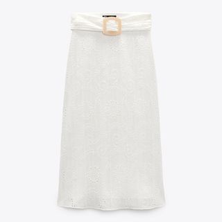 flat lay of white embroidered eyelet zara skirt