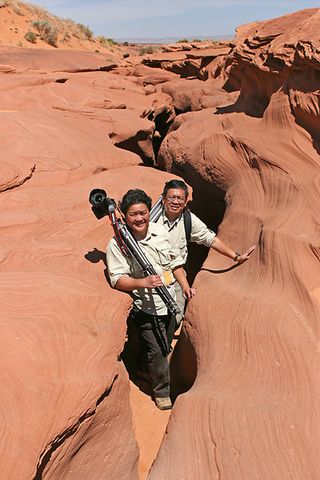 Veteran eclipse chasers Imelda Joson and Edwin Aguirre emerge from Arizona's Lower Antelope Canyon during a May 2012 annular solar eclipse expedition.