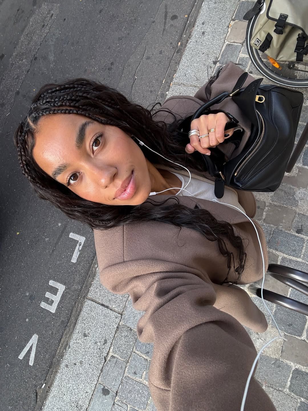 Amaka Hamelijnck wears her hair in wavy, knotless braids