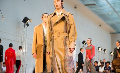 Male models wearing camel coloured clothes from the Alexander McQueen S/S 2018 collection