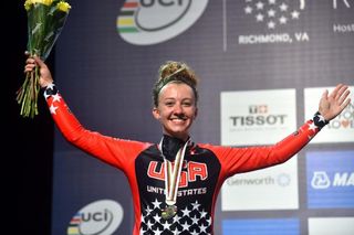 A beaming Emma White (USA) celebrating silver against the clock