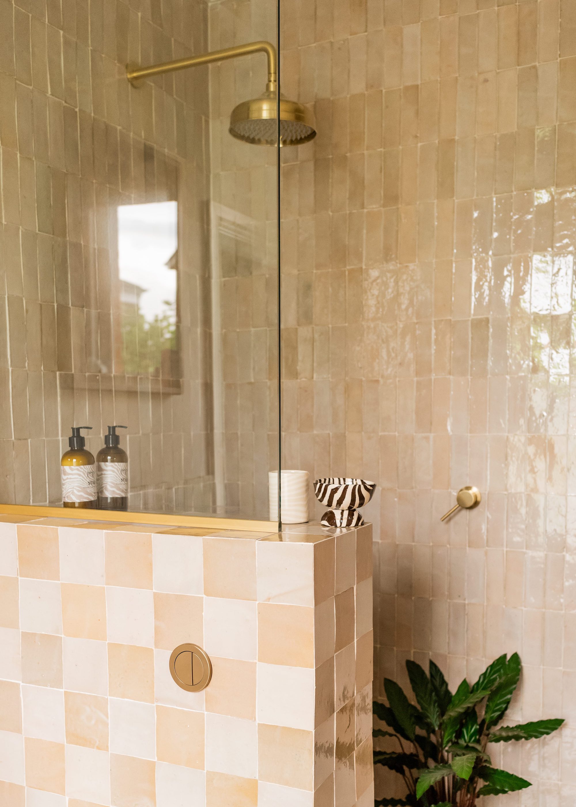 shower with tiled dwarf wall topped with glass screen