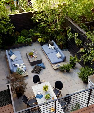 The Manscapers designed backyard in New York with plants and outdoor furniture