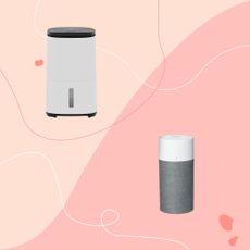 Air purifier and dehumidifier on pink background