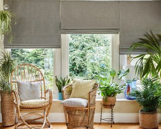 Grey Roman Blinds in conservatory by Hillarys