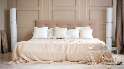 Mattress on bed in pink bedroom 