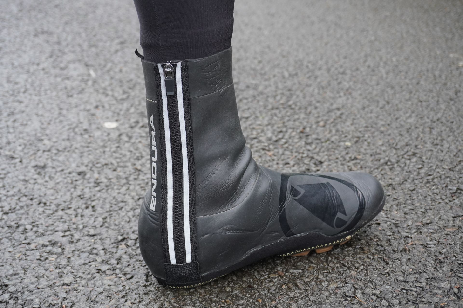 Image shows a rider wearing Endura's Freezing Point Overshoe IIs.