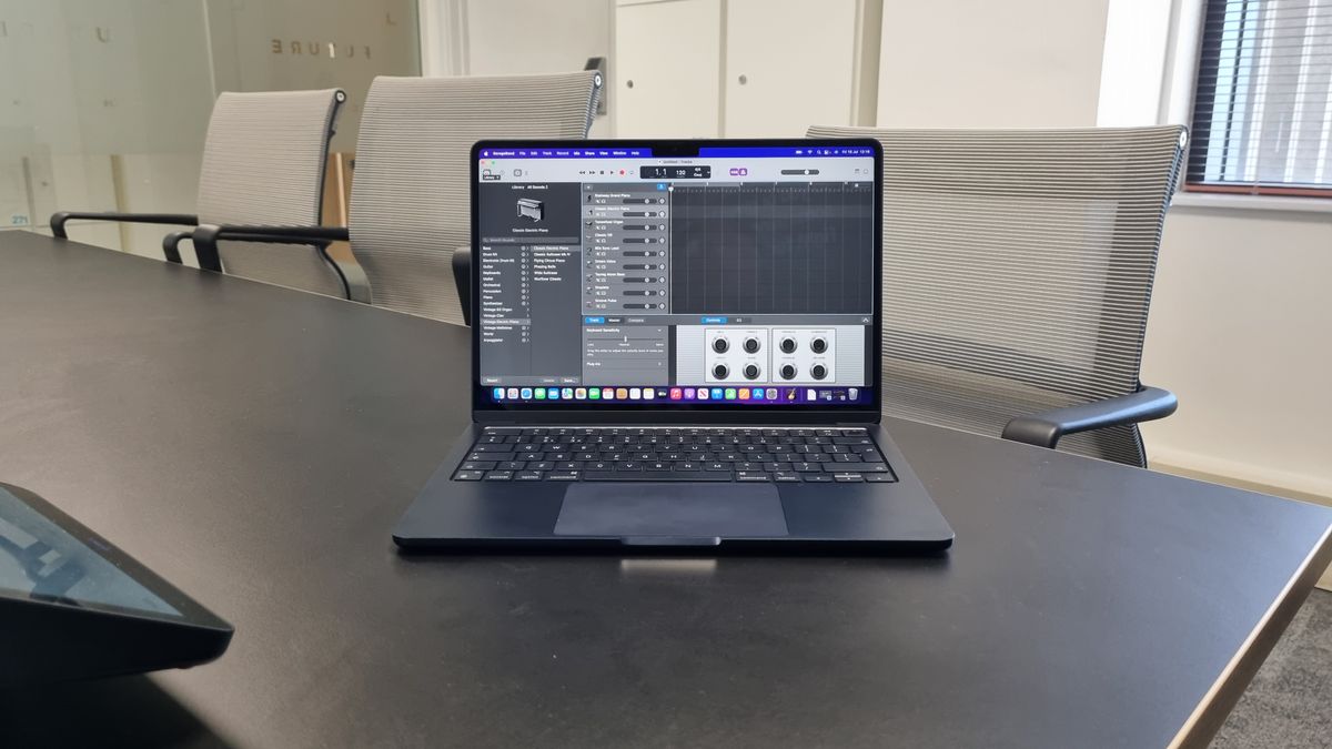 MacBook Air laptop in an office on a black desk