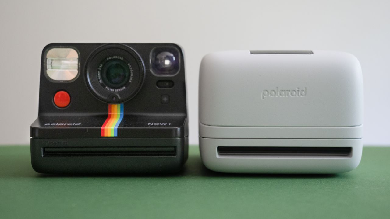 Polaroid Now+ Gen 2 next to a Polaroid Flip, on a green surface