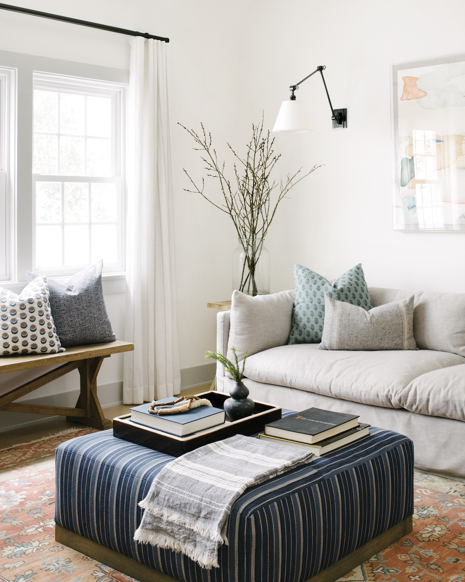 white living room with sheer curtains