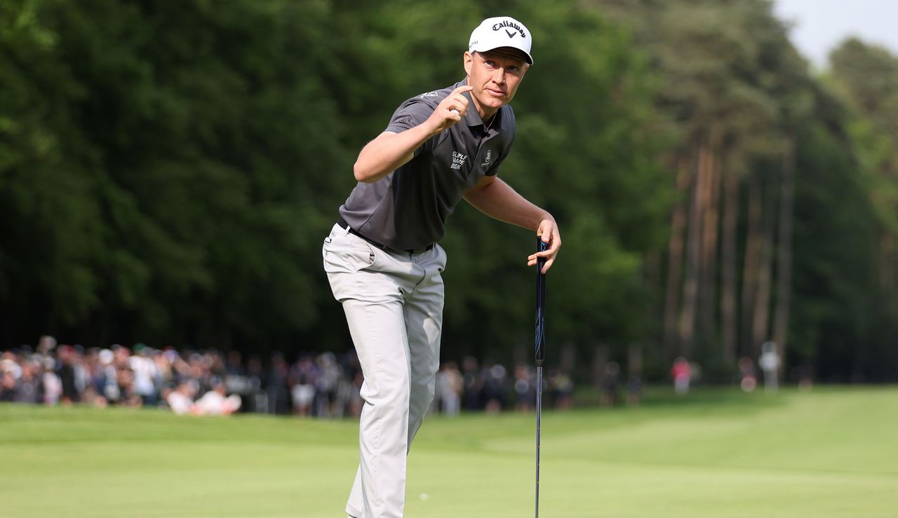 Simon Forsstrom waves to the crowd after holing the winning putt on the 18th hole