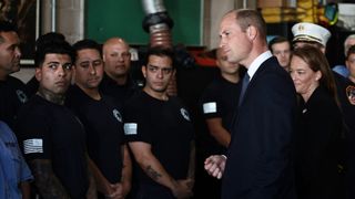 Prince William, Prince of Wales, speaks while visiting a New York Fire Department Firehouse