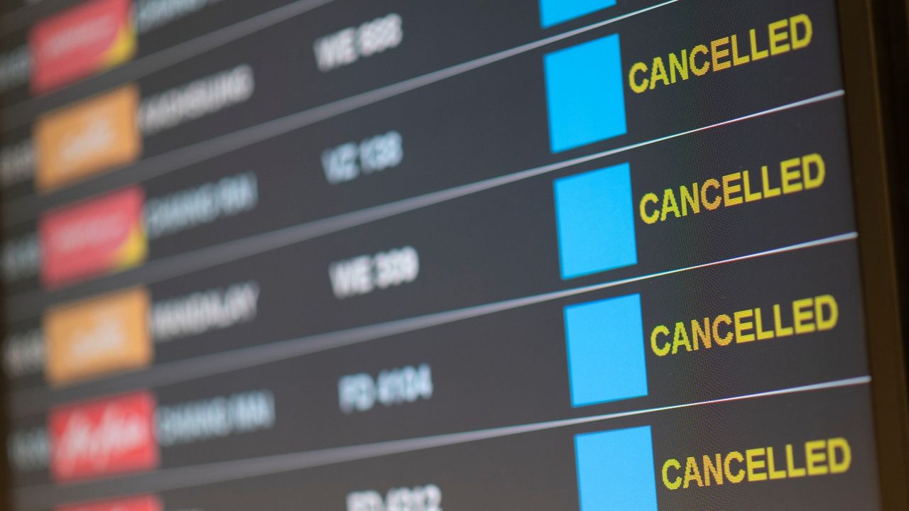 Pictures of departure board with cancelled flights