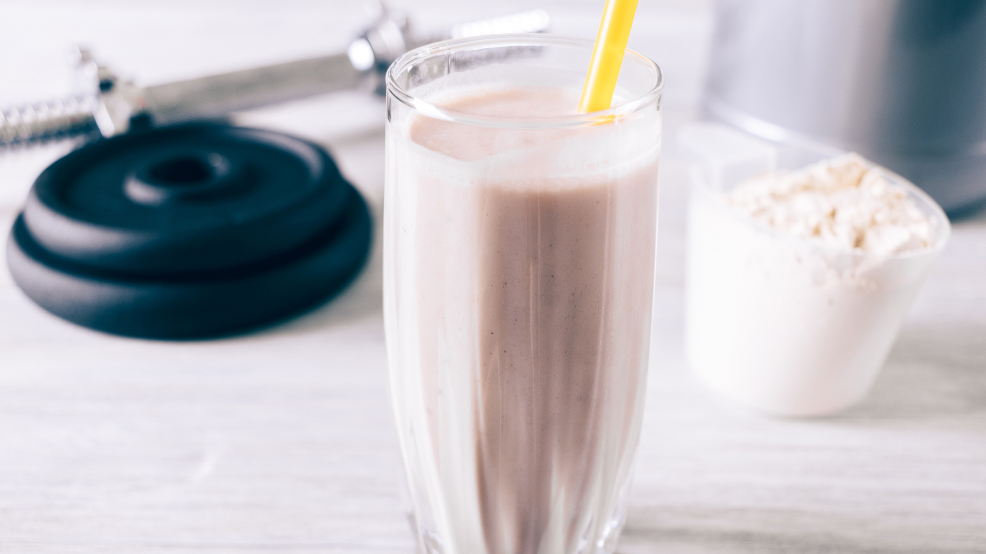 meal replacement shake in a glass with a straw