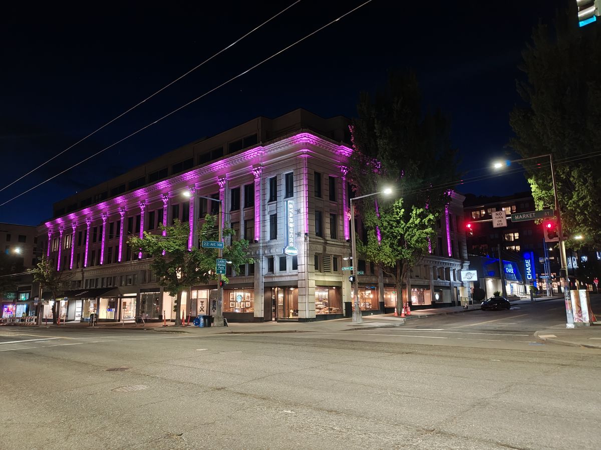 A building at night lit with purple lights