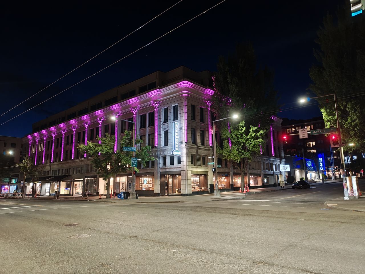 A building at night lit with purple lights