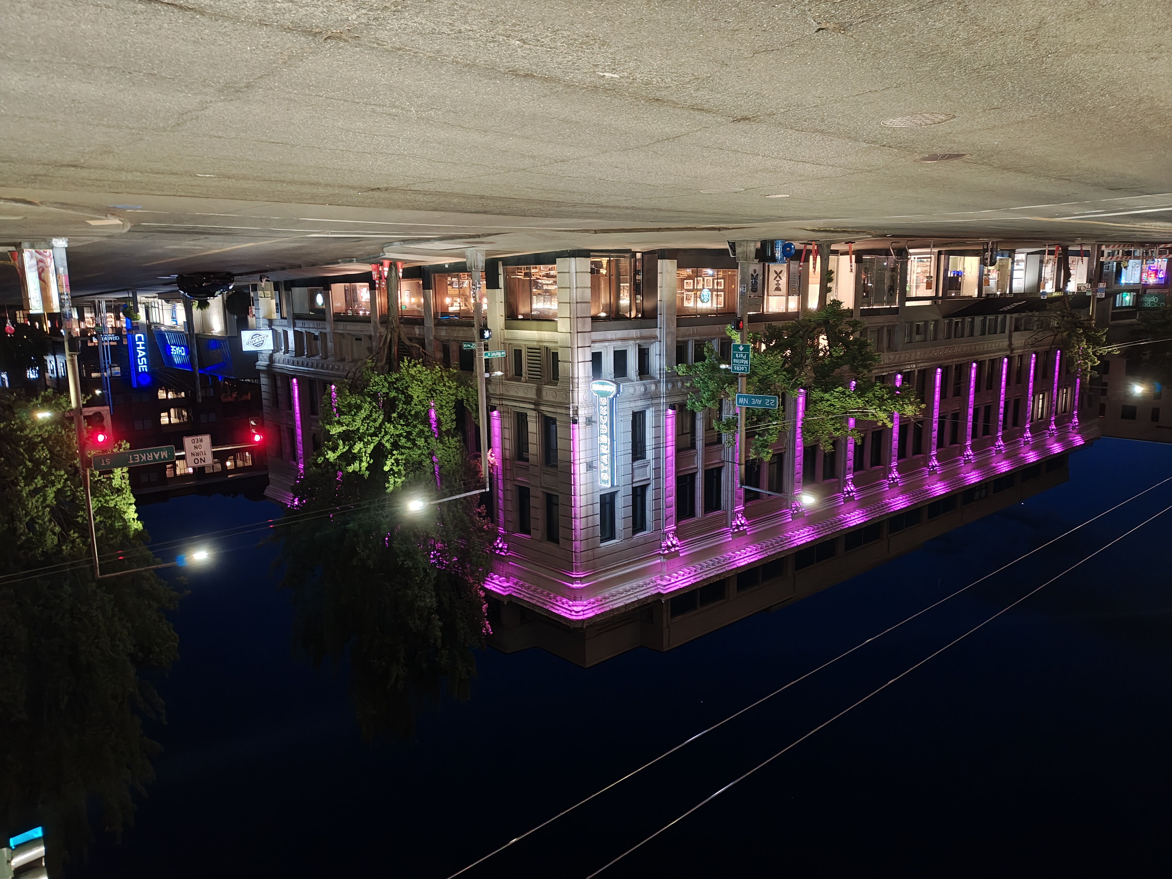 A building at night lit with purple lights
