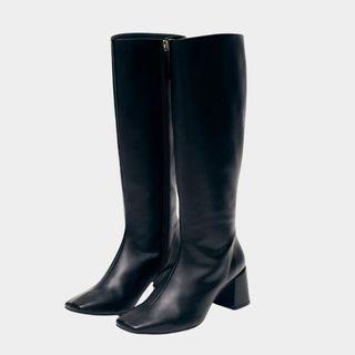 flat lay image of black high knee boots