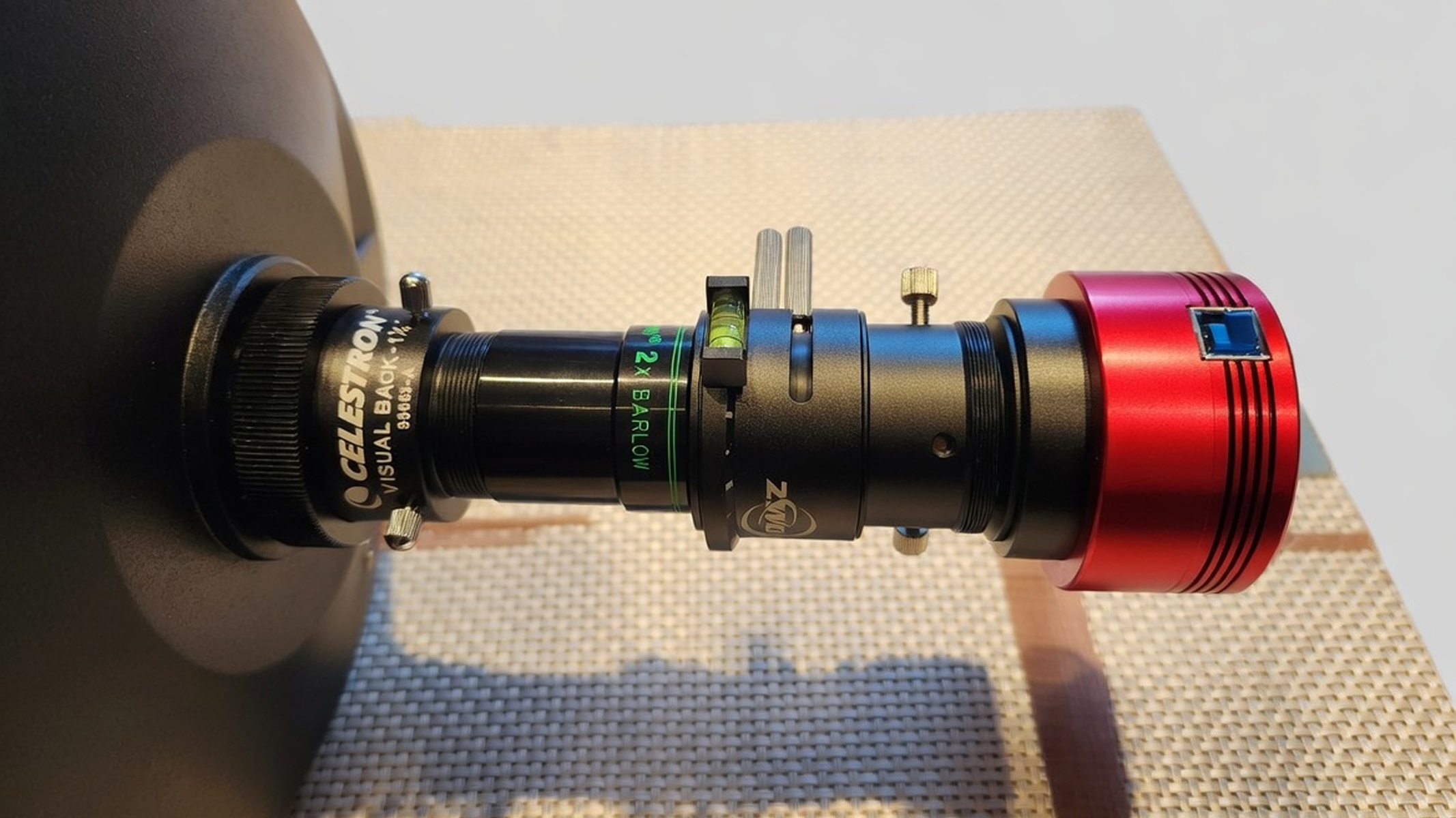 A camera attached to a Barlow lens on a telescope