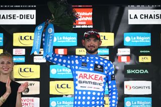 LA CHAISEDIEU FRANCE JUNE 05 Donavan Grondin of France and Team Arka Samsic Polka Dot Mountain Jersey celebrates at podium during the 75th Criterium du Dauphine 2023 Stage 2 a 1673km stage from BrassaclesMines to La ChaiseDieu 1080m UCIWT on June 05 2023 in La ChaiseDieu France Photo by Dario BelingheriGetty Images