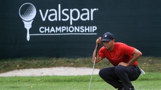 Tiger Woods lining up a putt at the 2018 Valspar Championship