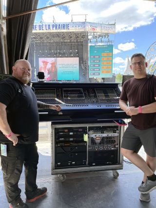 Sound mixers for Kelsea Ballerini's tour stand in front of DiGiCo equipment.