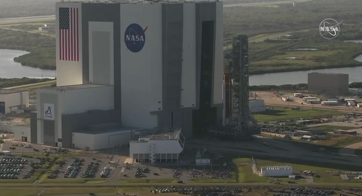 The Space Launch System rocket and Orion capsule that will launch on NASA's Artemis 1 moon mission emerge from the Vehicle Assembly Building at NASA's Kennedy Space Center during their rollout on March 17, 2022.