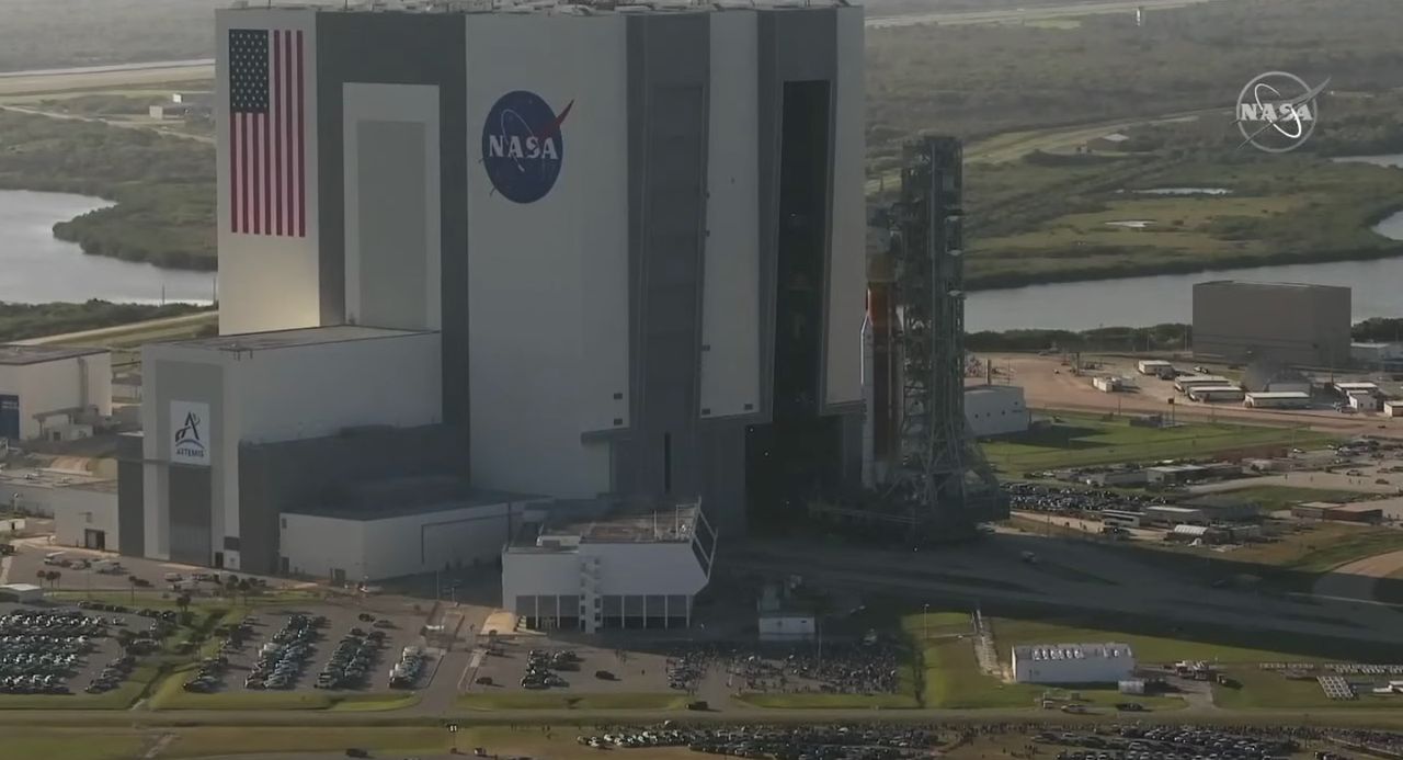 The Space Launch System rocket and Orion capsule that will launch on NASA's Artemis 1 moon mission emerge from the Vehicle Assembly Building at NASA's Kennedy Space Center during their rollout on March 17, 2022.
