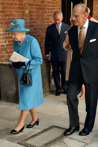Queen Elizabeth wearing the Flower Basket Brooch at Prince George's christening
