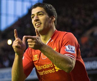 Luis Suarez celebrates after scoring for Liverpool, 2013