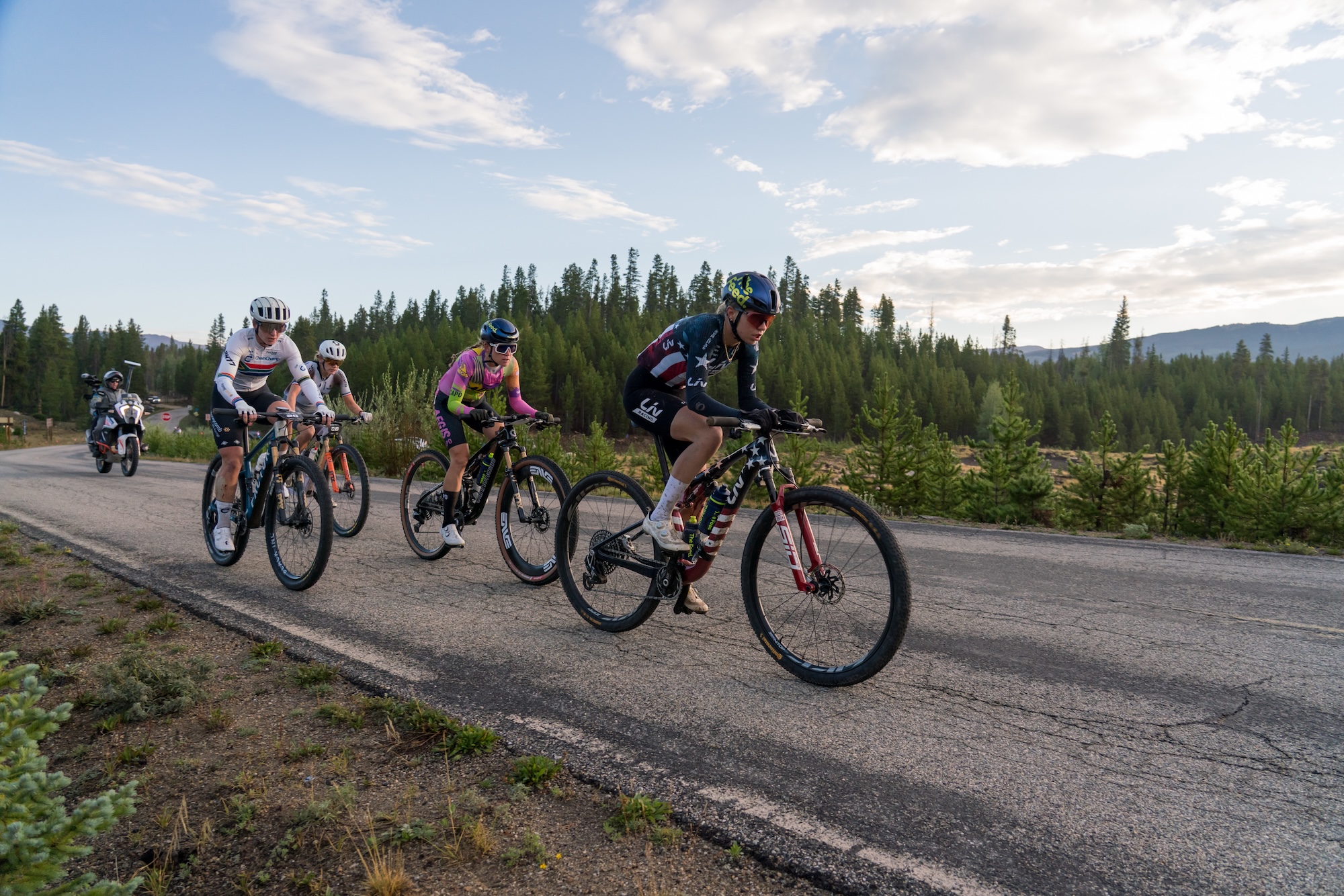 Outbound group of four riders in the chase led by Melisa Rollins