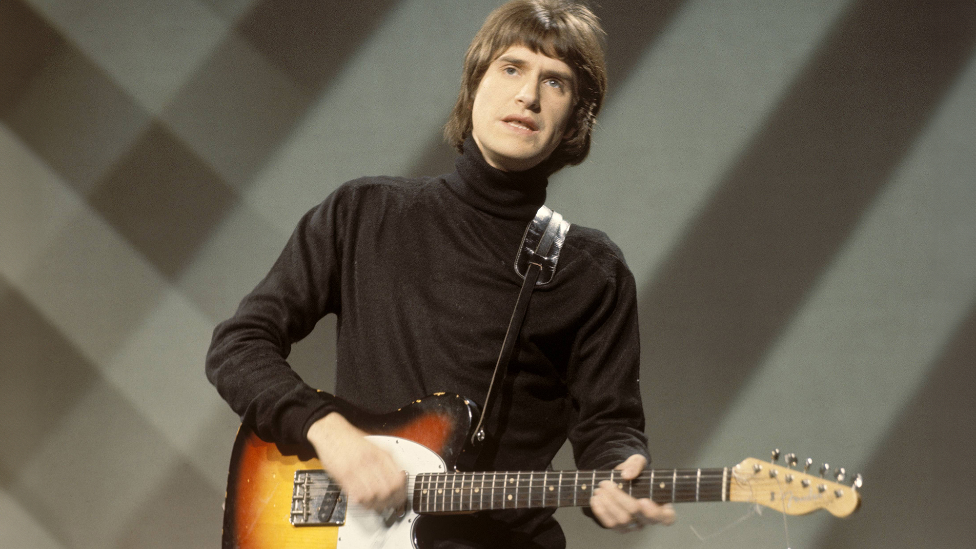 Ray Davies of English rock group The Kinks performs playing a Fender Telecaster guitar on a television show at BBC Television Centre in London in December 1965.