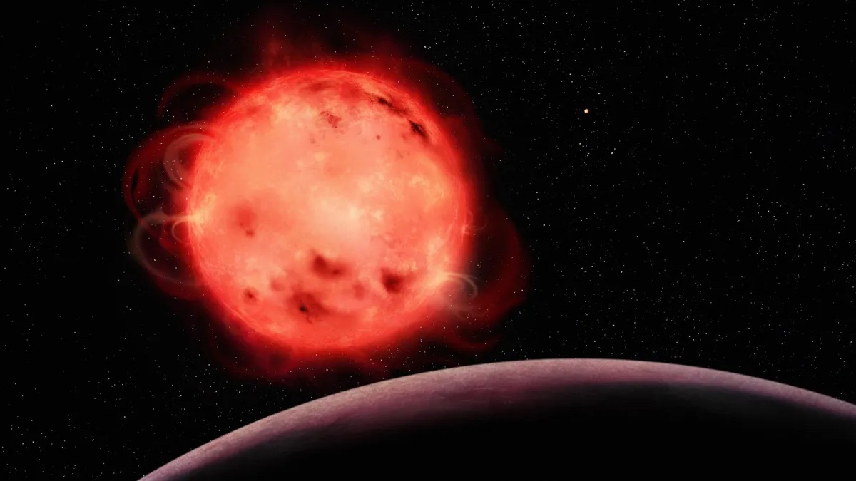 An artist's impression of the TRAPPIST-1 red dwarf star, with the planet TRAPPIST-1 b in the foreground.
