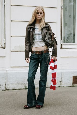 Women wearing dark wash denim flares