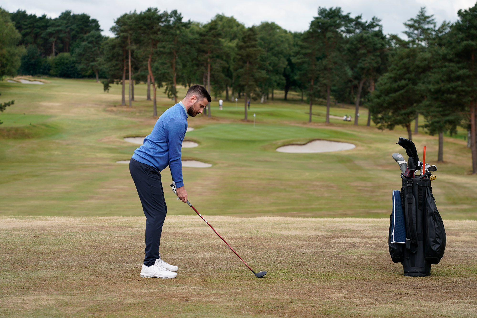 Baz Plummer in the setup position with fairway wood, preparing to hit an approach shot from over 200 yards at Sand Moor Golf Club