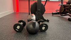 dumbbells and kettlebell on the ground