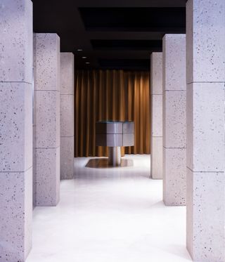 watch boutique interior with stone pillars
