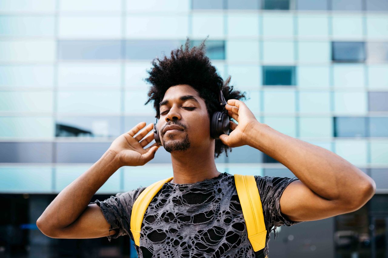 Man enjoying music he&#039;s streaming on his headphones