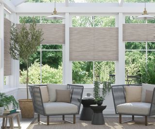 bottom up cream blinds in modern conservatory setting