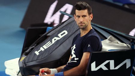 Novak Djokovic takes a break from training at Melbourne Park 