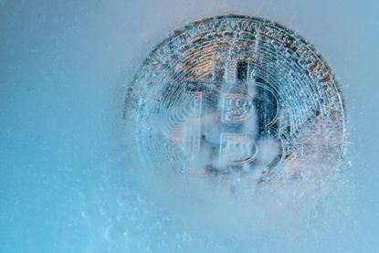 digital crypto winter rendition of Bitcoin frozen in ice