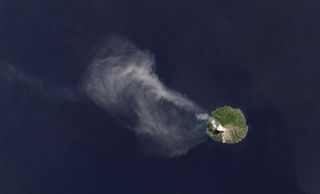 An ash plume drifts from Paluweh volcano in Indonesia in this image, taken April 29, 2013 from the Landsat Data Continuity Misison's Operational Land Imager instrument.