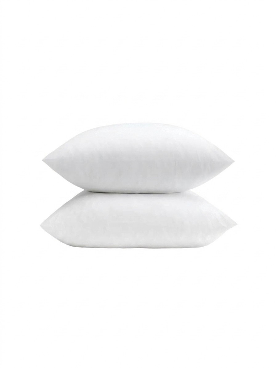 A set of two pillows dressed in Coop Sleep Goods Cool+ pillowcases