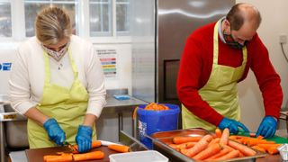 Prince Andrew and Sophie Wessex peeling and chopping carrots