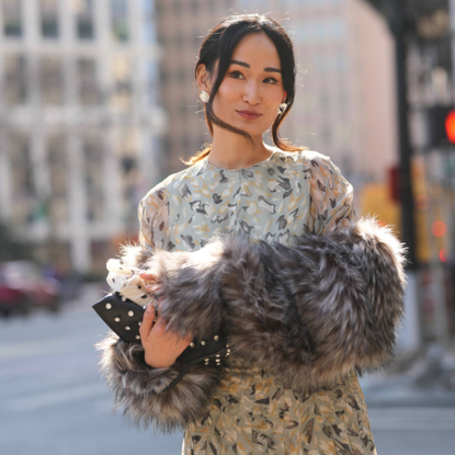 woman wearing a floral dress.