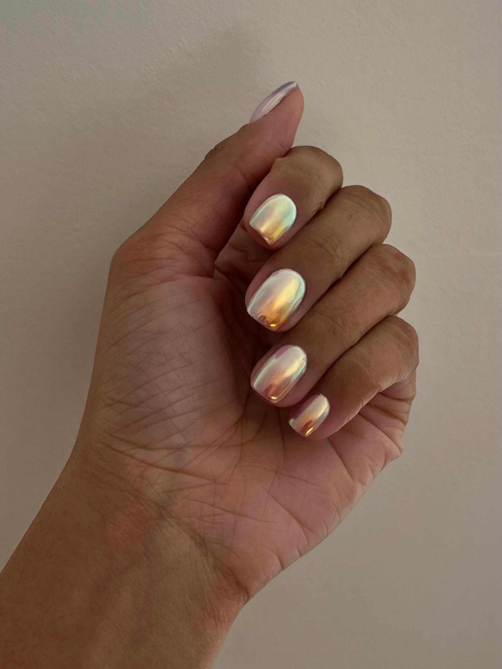 A close-up picture of a chrome manicure