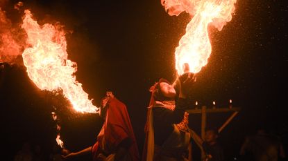 Fire breathers perform during celebrations marking the beginning of the Islamic New Year in Bandung, West Java